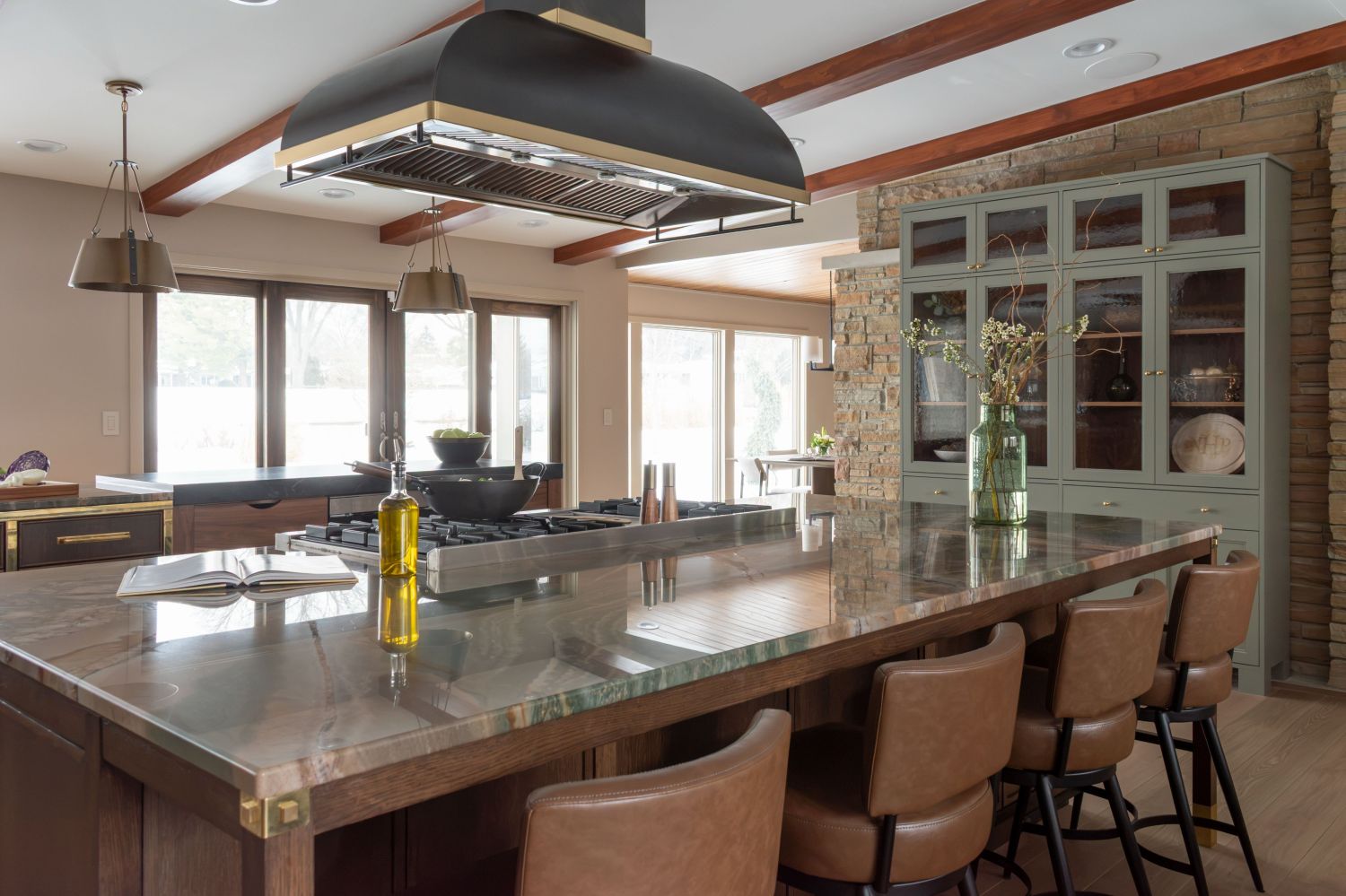 kitchen island with custom rangecraft hood plato cabinetry and botanic quartzite countertop