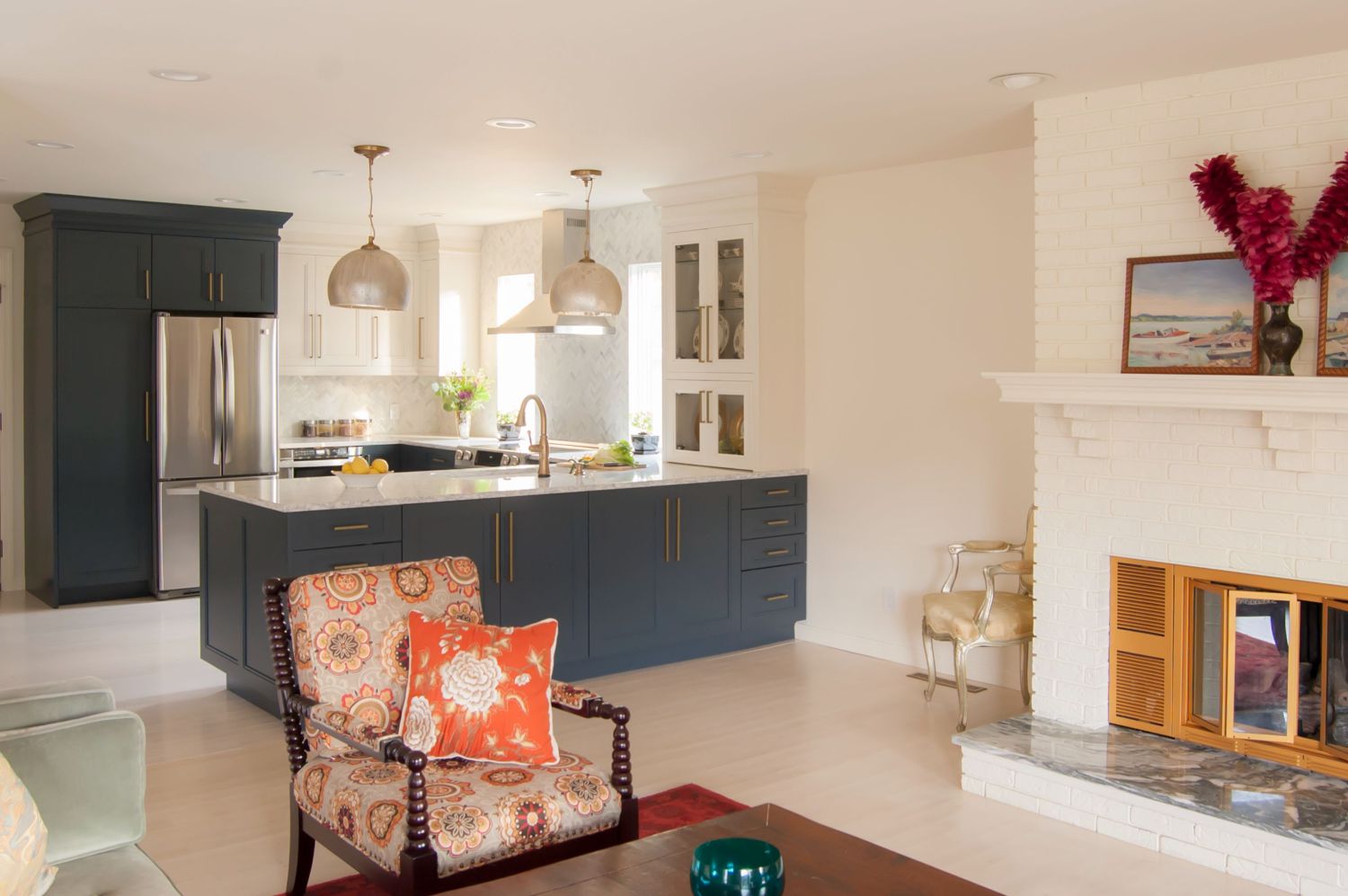 Navy and white kitchen open to living room