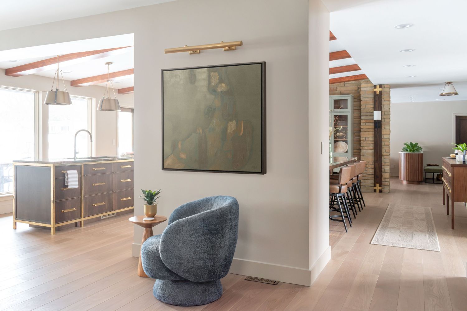 art wall in lvingroom with natural light Carlisle wood plank flooring