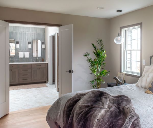 Primary bedroom and bathroom with double doors