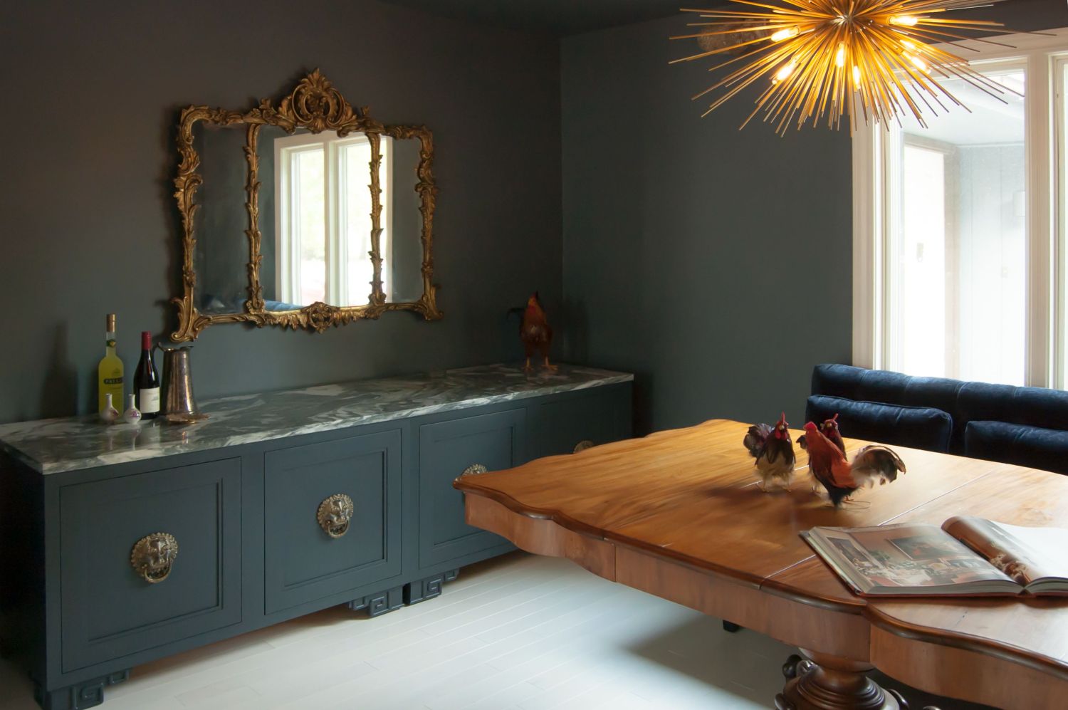 Dark and Moody dining room with Mirage Maple Nordic flooring Binaco Giada countertops