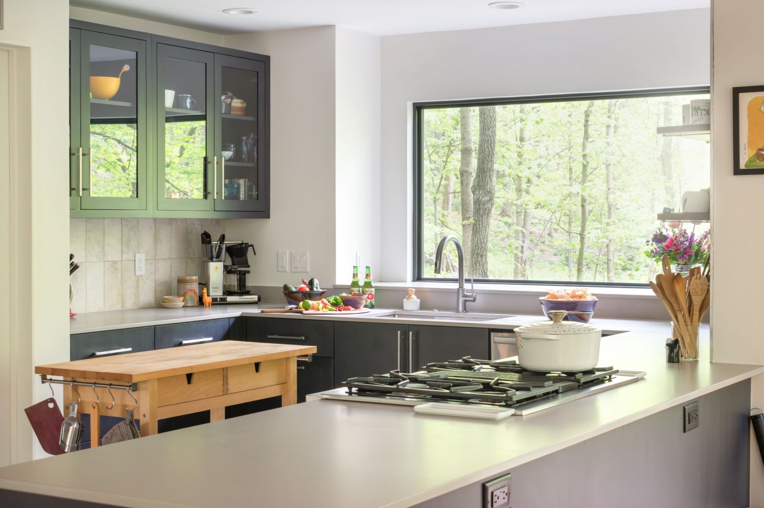 Kitchen with Eclipse and Shiloh maple cabinetry with large picture window