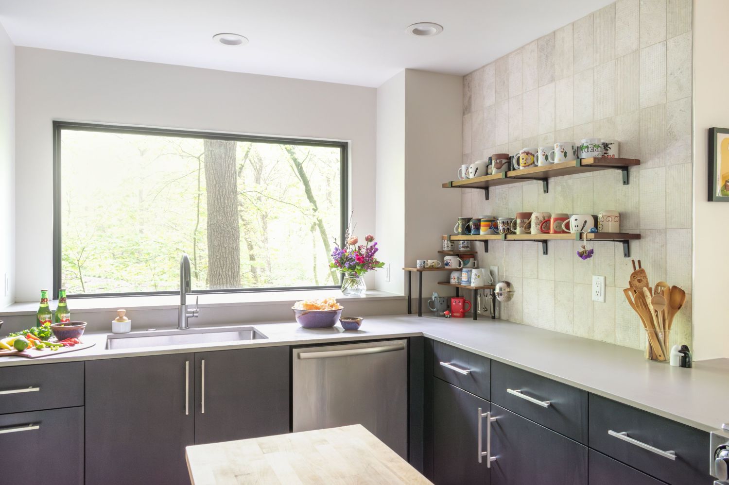 Eclipse maple cabinetry with open shelving and wall tile