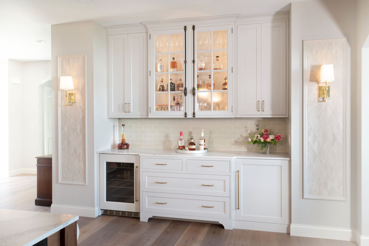 Kitchen bar with painted cabinets Cremona bolts integrated wine refrigerator wall sconces
