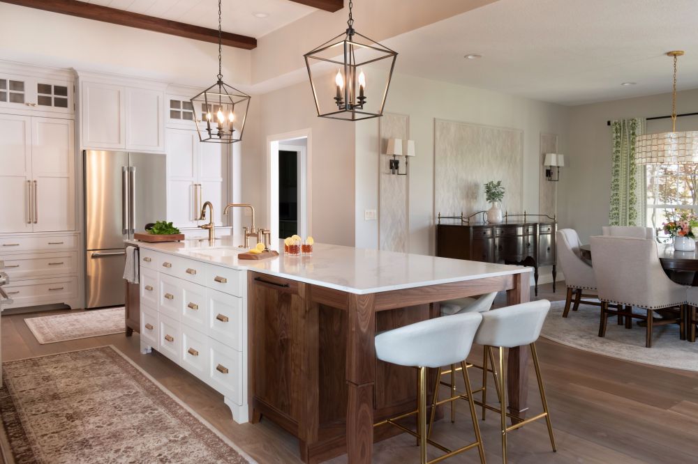 Kitchen island with custom drawer fronts and integrated dishwasher. Havwoods flooring open to dining room plato woodworks