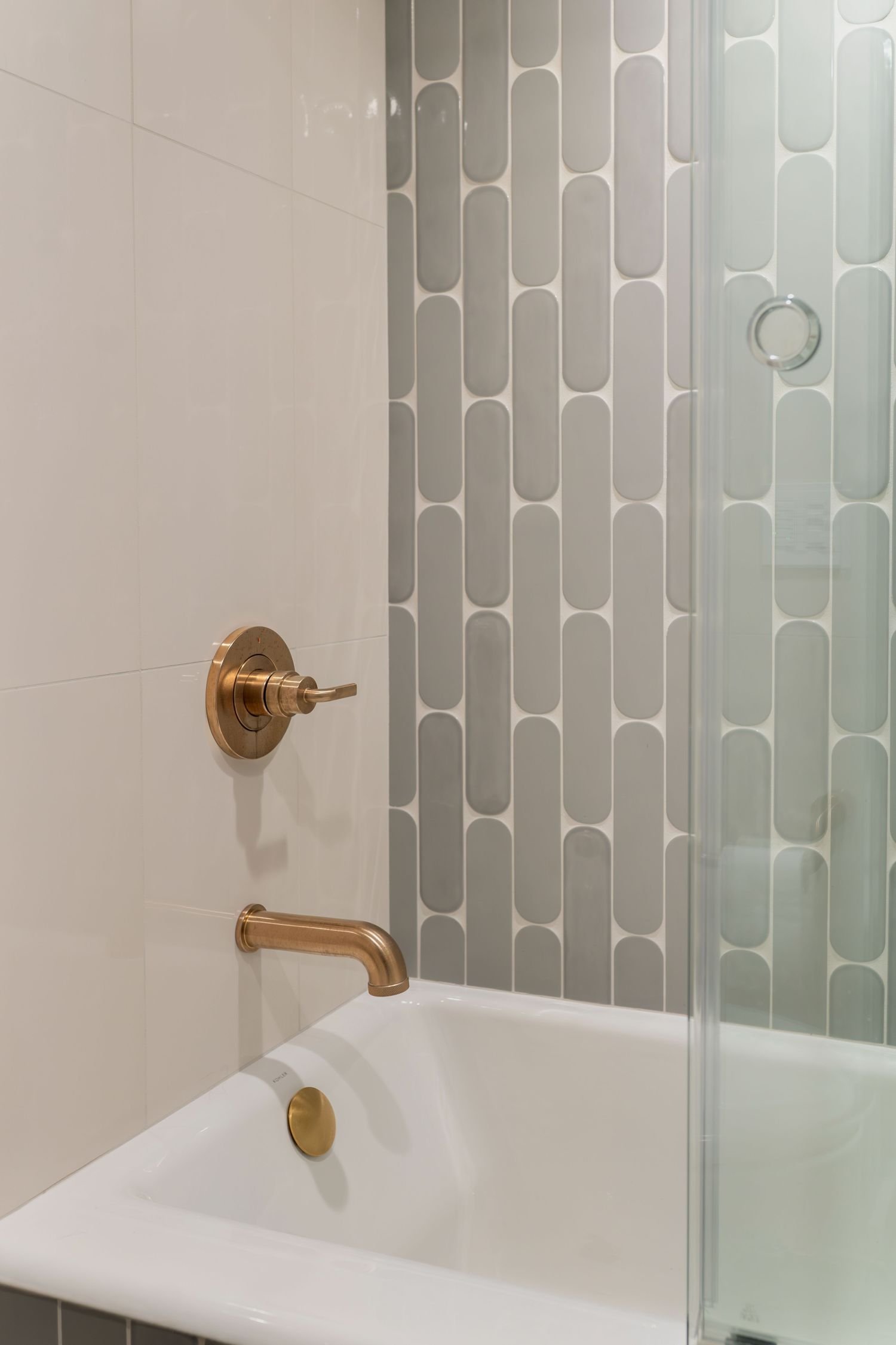 tile in tub shower alcove with Kohler shower faucet