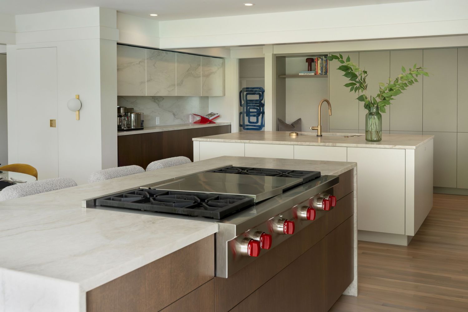 wolf rang top in plato woodworks island in modern light filled kitchen