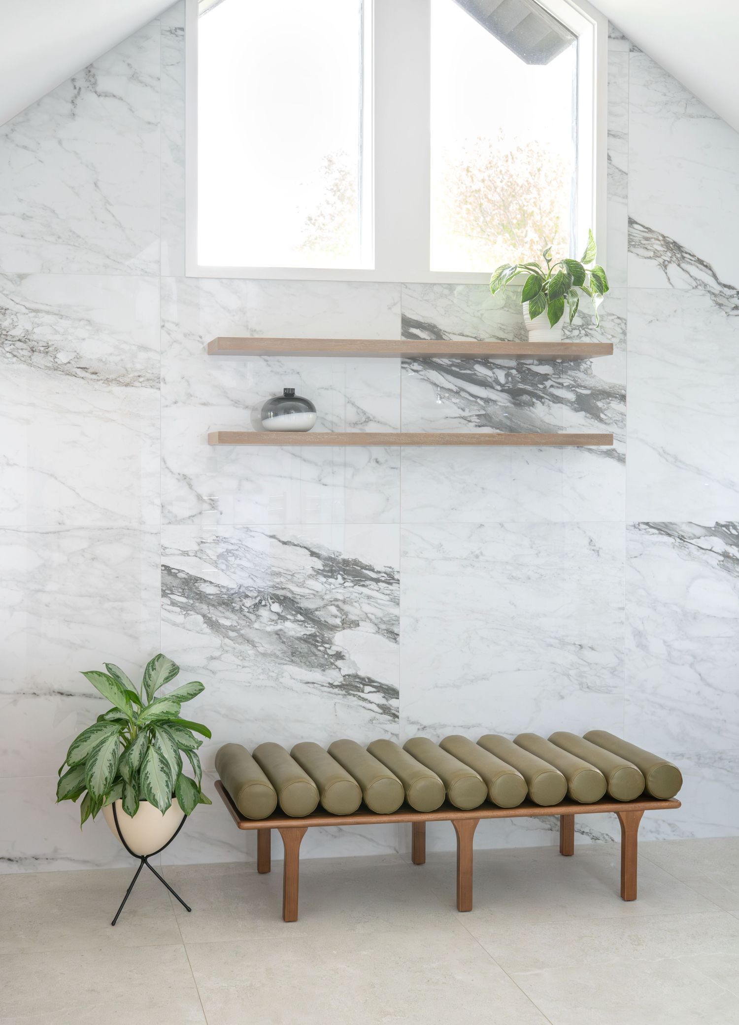 imola tile and bench in large natural light filled primary bath