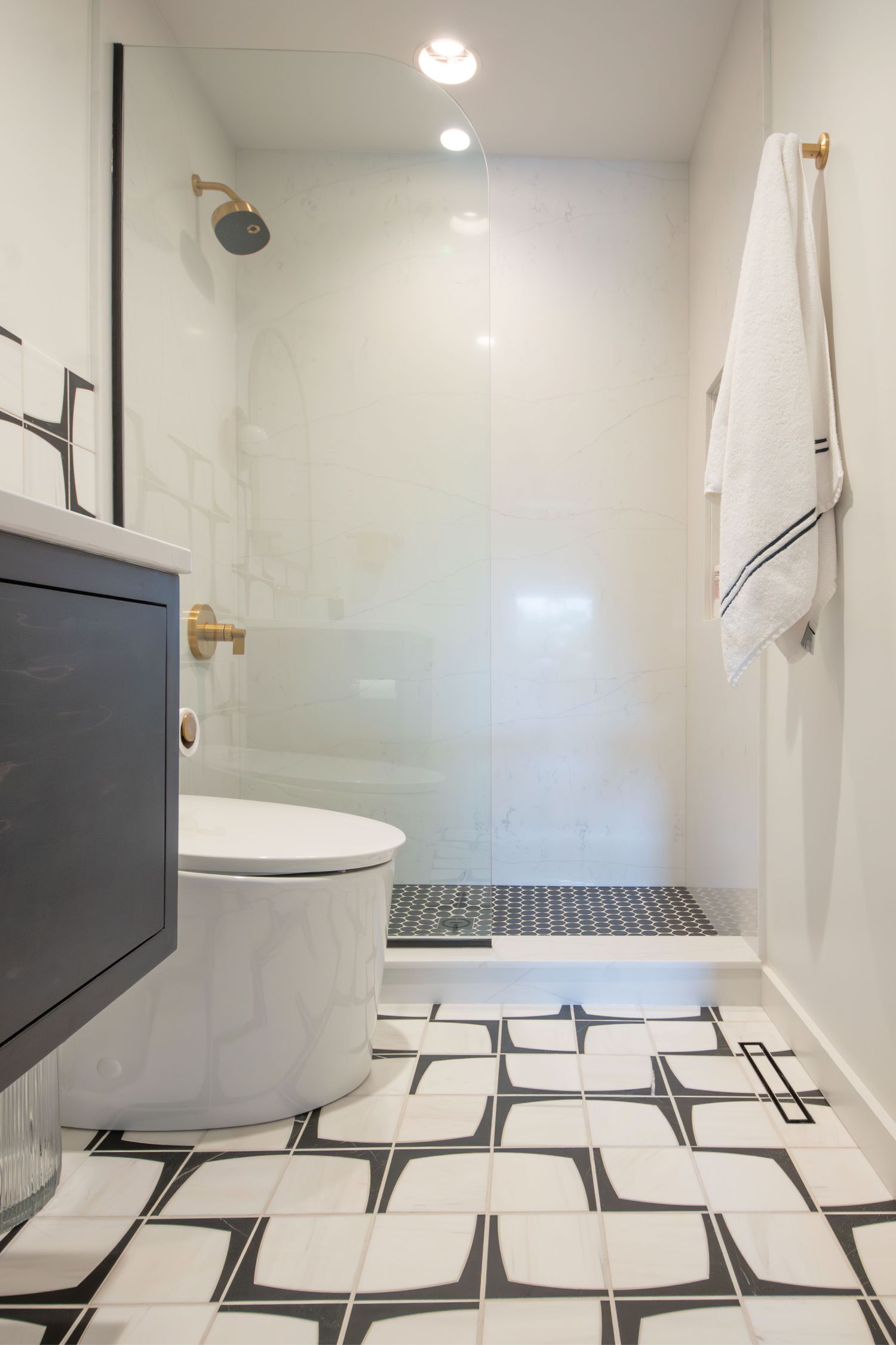 marble floor in guest bathroom with floating vanity