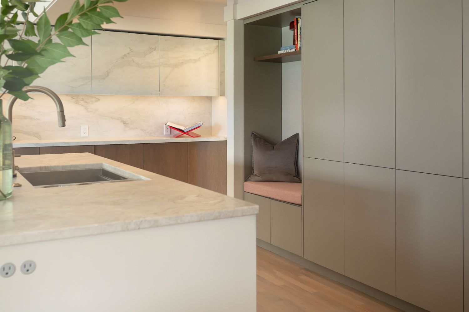 PLato woodworks painted kitchen cabinetry with sitting nook