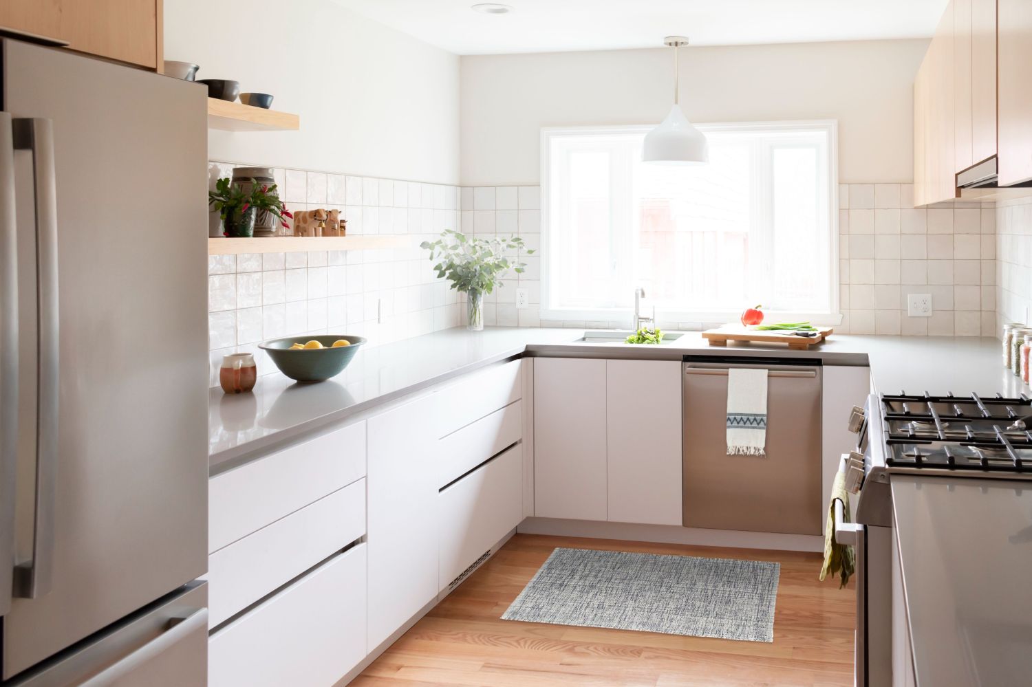 scandinavain inspired kitchen with gola channel cabinetry by eclipse