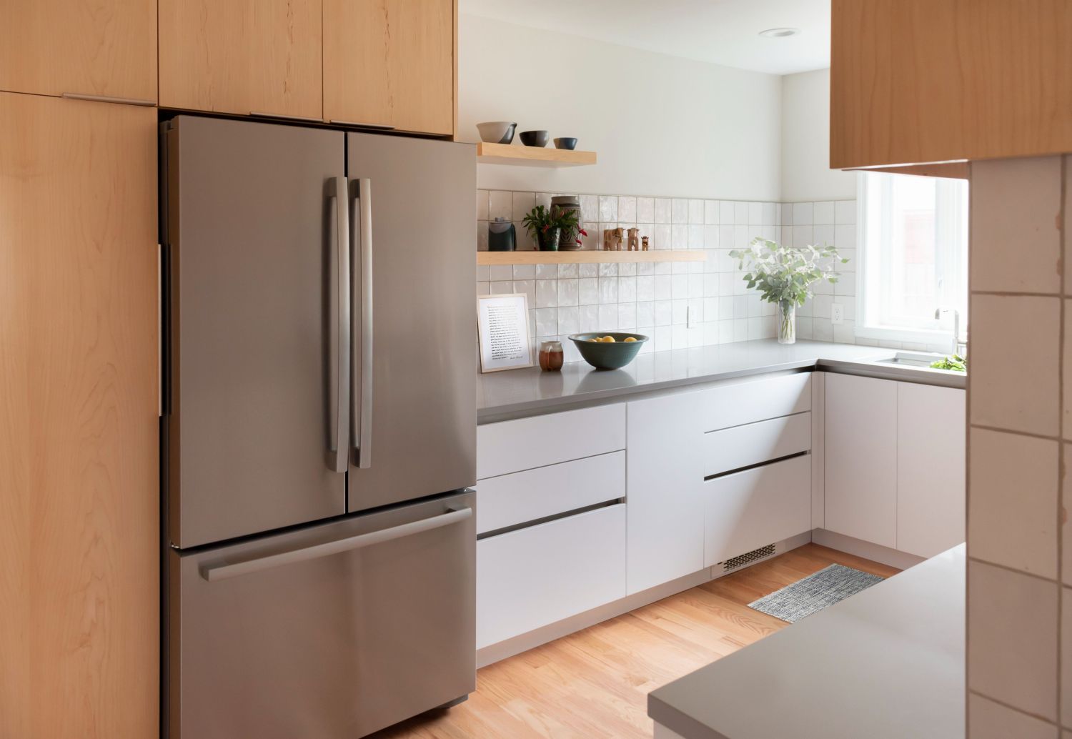 maple and white kitchen with floating shelves