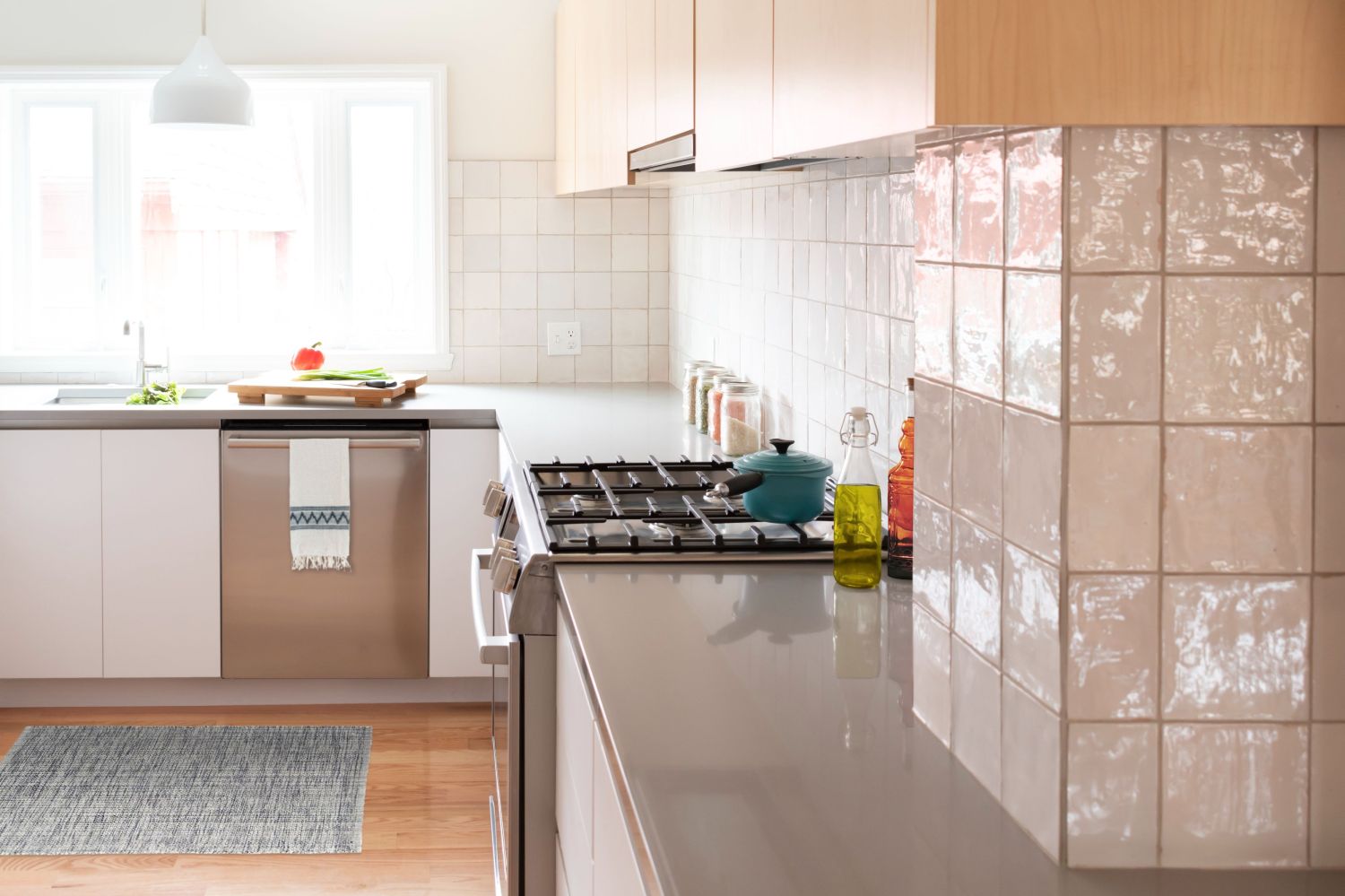 tile wrapped pipe chase in scandinavian inspired kitchen