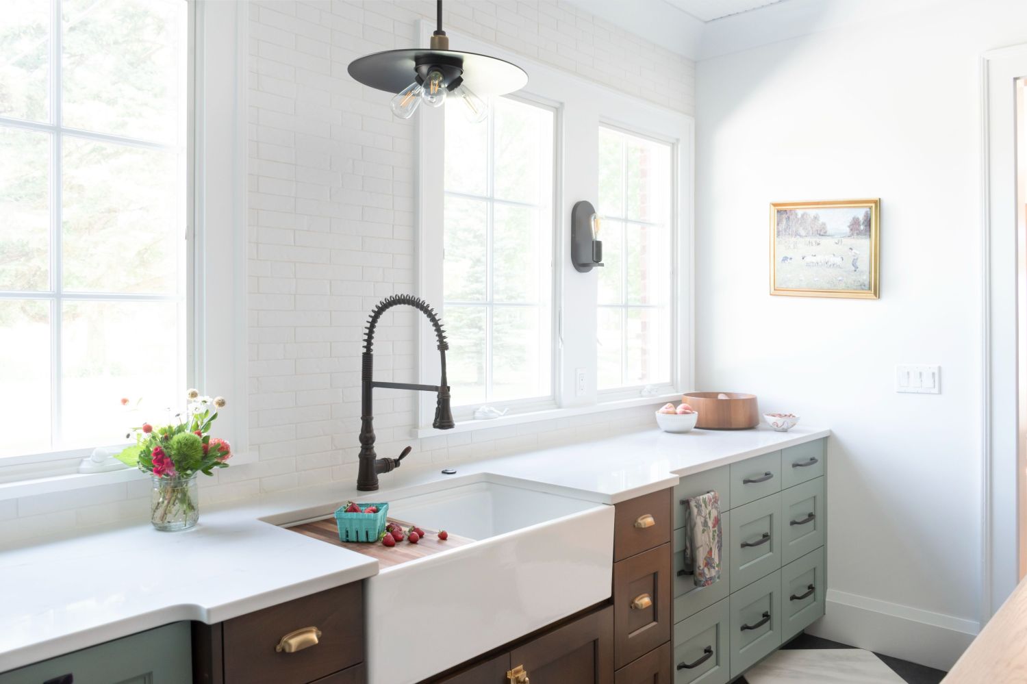 apron sink in large kitchen with natural light