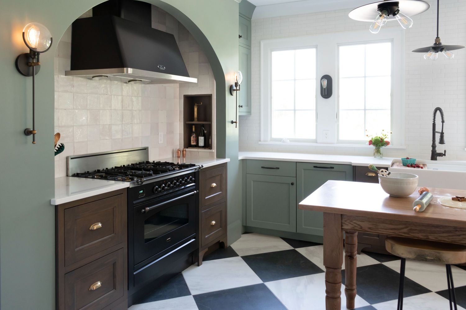 large historic kitchen with wall sconces and natural light