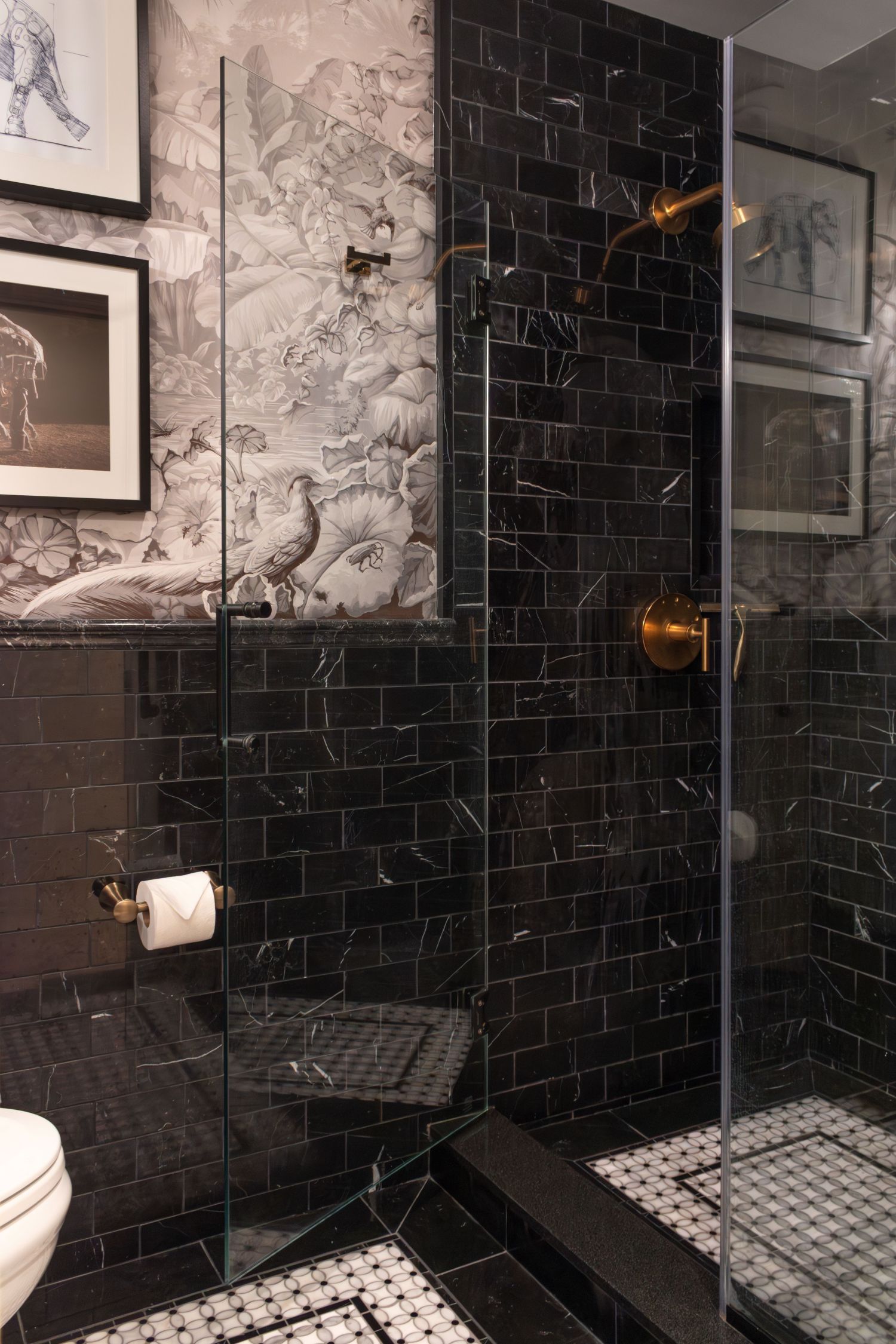 Guest Bath with shower black marble wall tile and herringbone floor