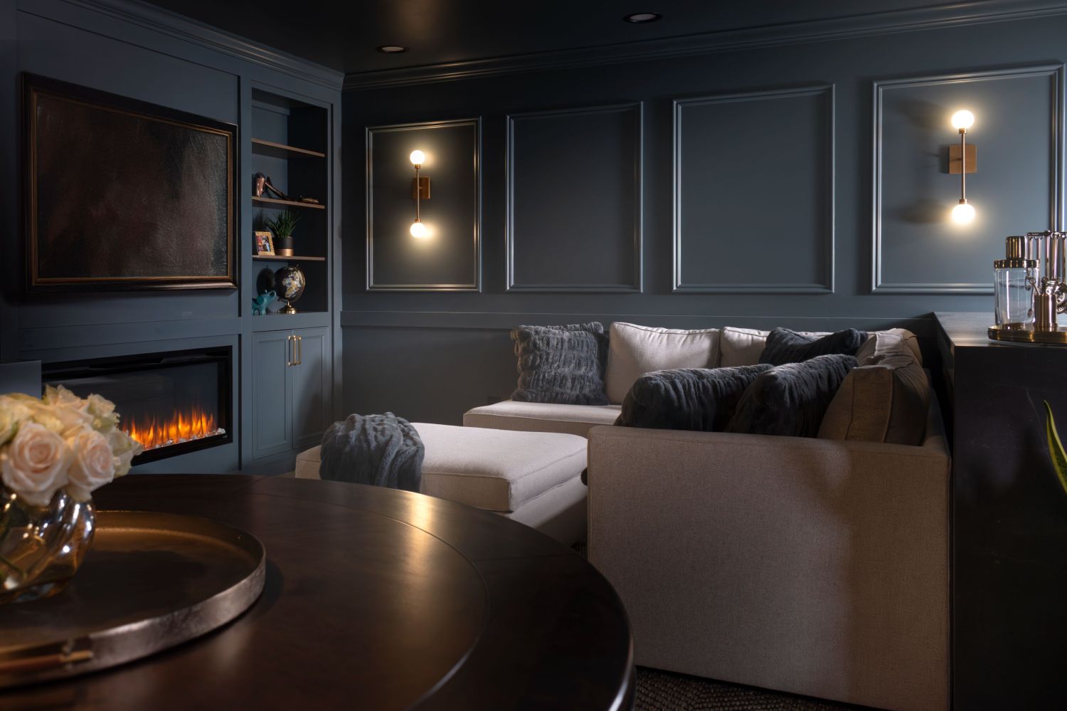 Dark and moody basement with fireplace