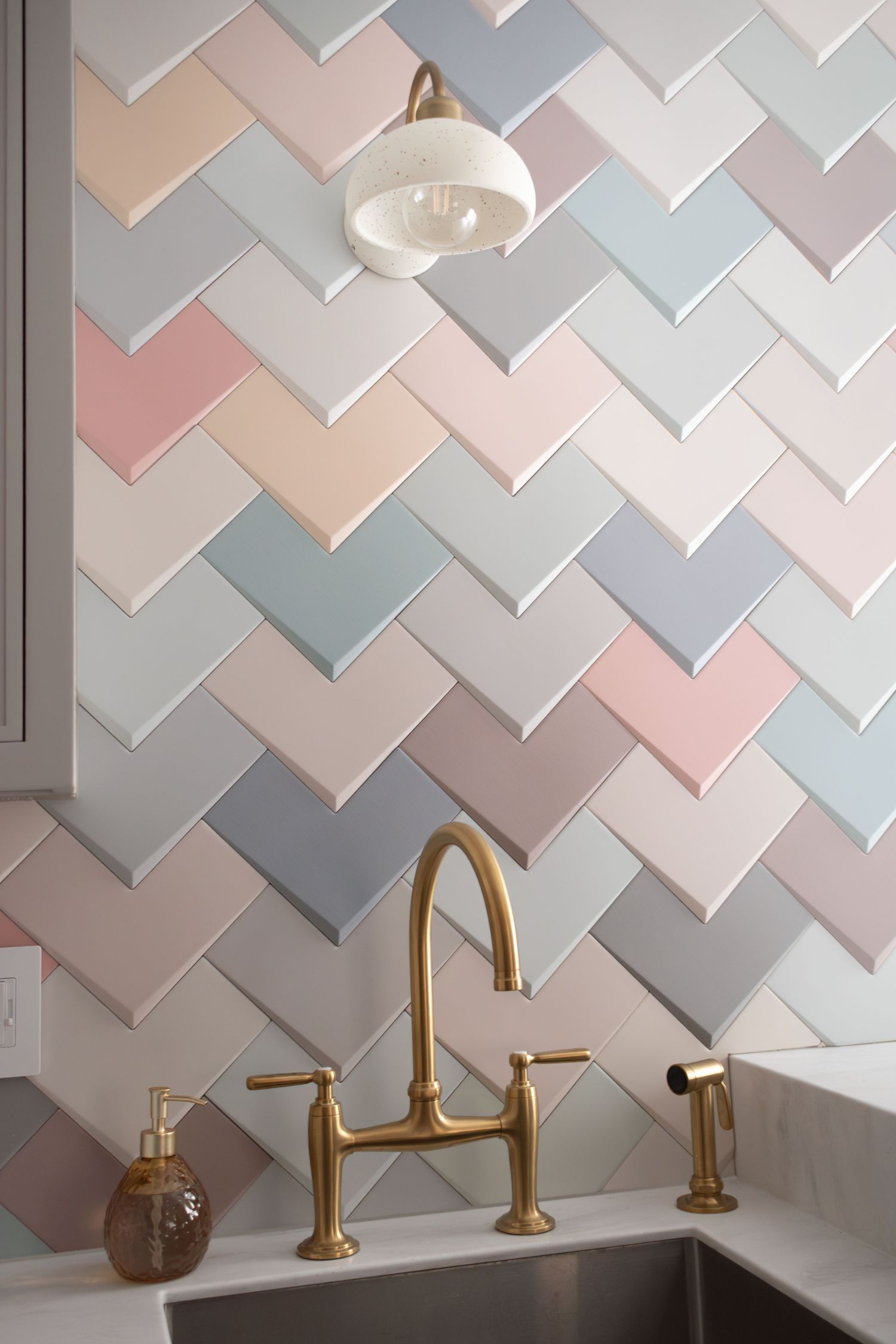 WOW boho mix Elle 8x8 dimensional wall tile in laundry room with Kohler Edalyn faucet