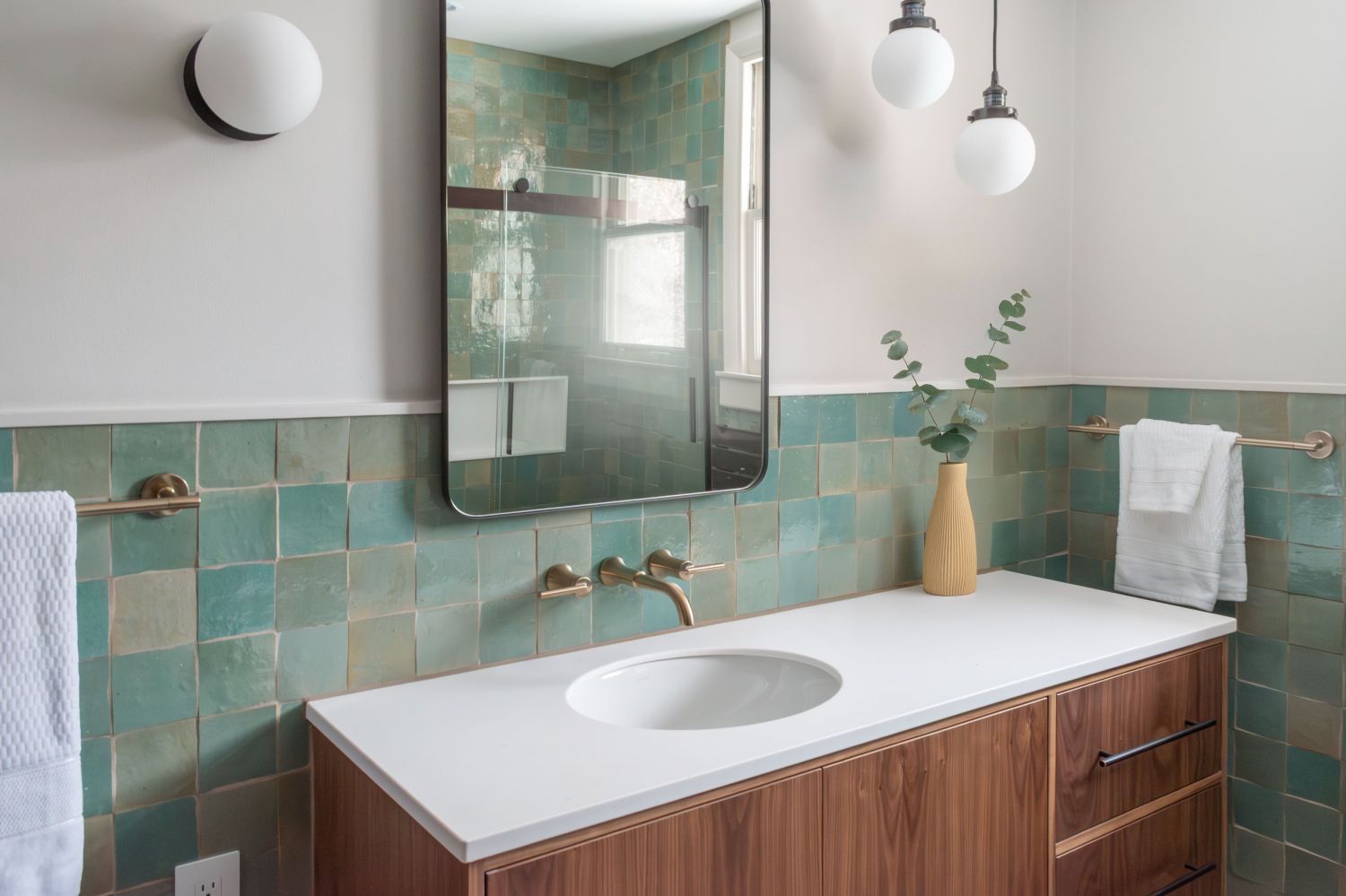 Bathroom with walnut vanity corian top Delta Trinsic wall mount faucet LiLi Agave Green Zellige Tile