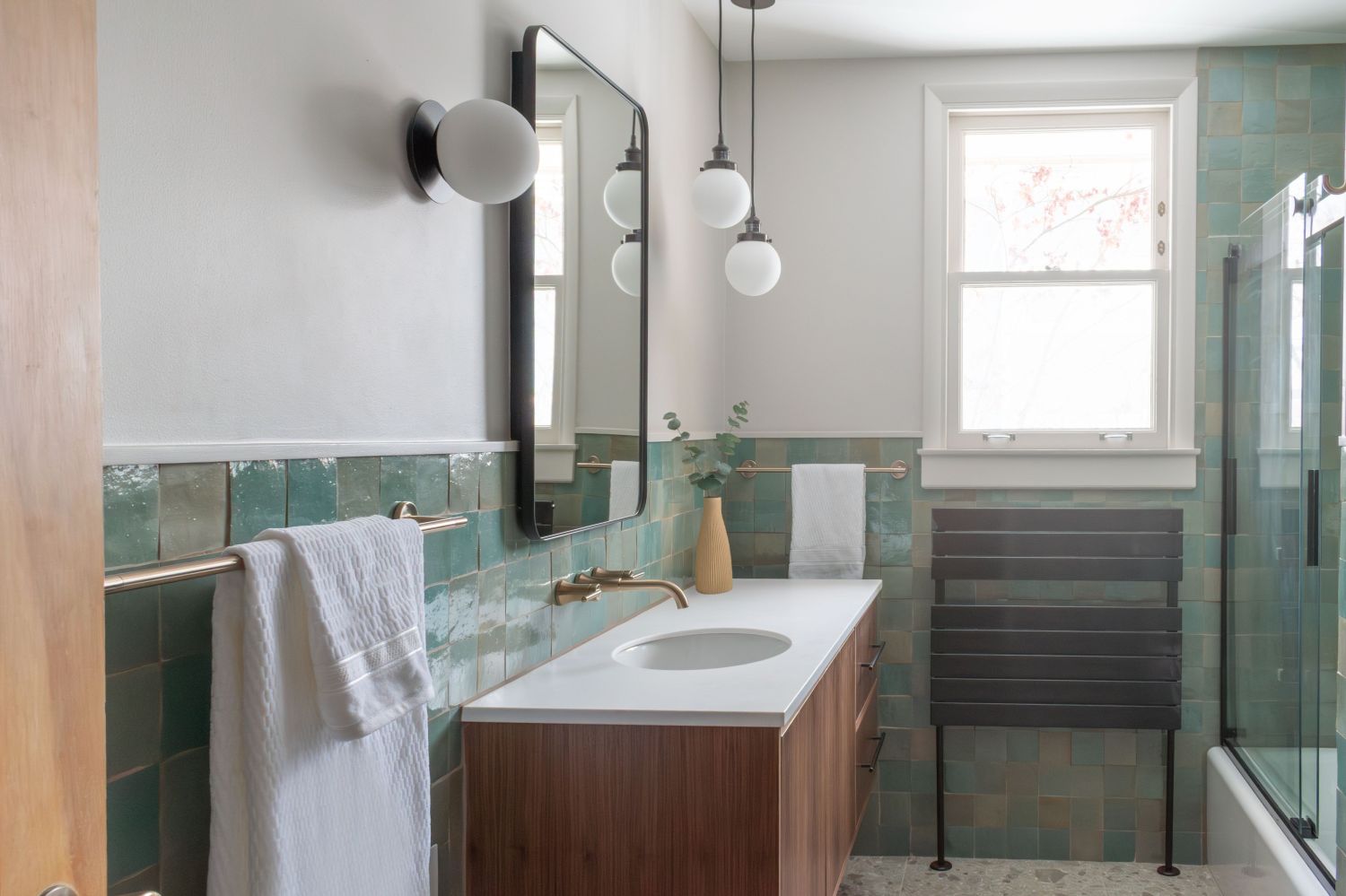 Bathroom with lili tile Agave Green Zellige  hot water towel warmer metal framed mirror with rounded corners